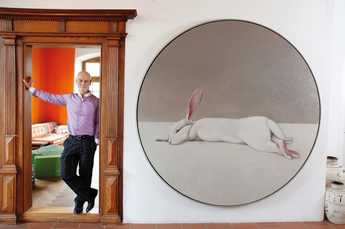 Uli Sigg next to the painting «Moon Rabbit» by Shao Fan © Sigg Collection Photo: Karl-Heinz Hug